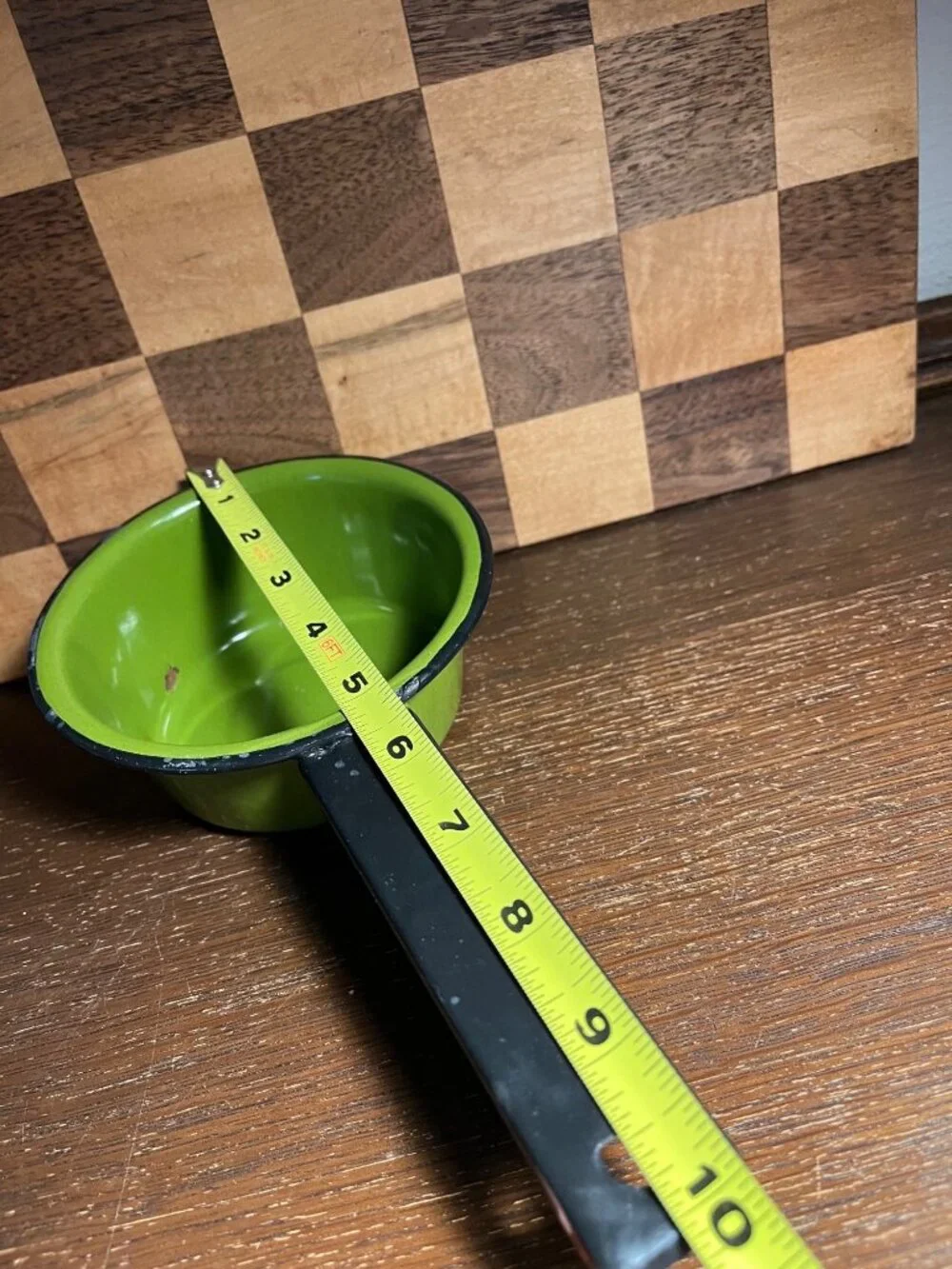 Vintage Small Avocado Green Enamel Pan with Black Handle, shows wear